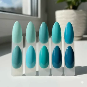 Comparison of different shades from light to dark turquoise nail polish colors.