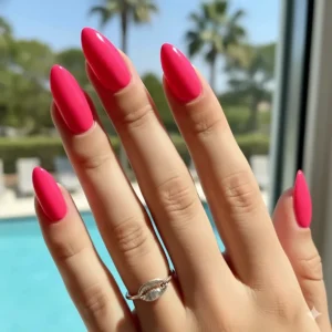 Bold and bright manicure featuring an eye-catching neon hot pink nail polish for a fun, summery style.