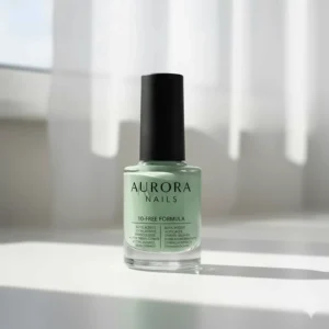 An image of a light green nail polish bottle, highlighting the clean, 10-free formula ingredients.
