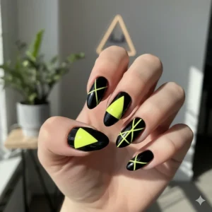 A fun, trendy nail art design featuring neon yellow nail polish accents with black geometric lines for contrast.