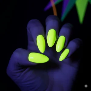 UV-reactive neon yellow nail polish glowing brightly under a blacklight, demonstrating its vibrant effect.