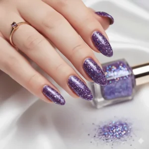 Finished purple glitter nails after applying a high-gloss top coat for extra shine.