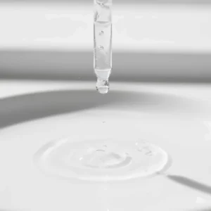 Close-up of a lightweight, non-greasy niacinamide serum texture suitable for congested pores.