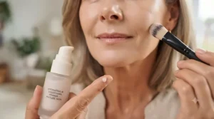 Applying smoothing primer before foundation for mature skin.