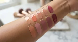 Arm swatches showing various shades of liquid blush for a natural flush in dewy and matte finishes