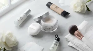 Flat lay of beauty products featuring a top-rated loose powder for oily skin.
